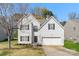 Charming two-story home featuring a well-maintained lawn, attached garage, and classic architectural details at 3015 Hendricks Chapel Ln, Charlotte, NC 28216