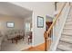 Inviting foyer with hardwood floors, staircase, and view to living room, creating a warm and welcoming entrance at 3015 Hendricks Chapel Ln, Charlotte, NC 28216