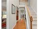 Inviting foyer with hardwood floors, staircase, and elegant decor, creating a warm and welcoming entrance at 3015 Hendricks Chapel Ln, Charlotte, NC 28216