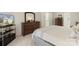 Comfortable main bedroom with a neutral color palette, dresser and TV at 3015 Hendricks Chapel Ln, Charlotte, NC 28216