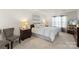 Spacious main bedroom featuring a tray ceiling, neutral colors, and comfortable furnishings at 3015 Hendricks Chapel Ln, Charlotte, NC 28216
