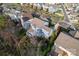 An aerial shot showcases the landscaped backyard, patio, and blue home exterior at 428 Vintage Hill Ln, Huntersville, NC 28078