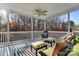 Relaxing back porch with overhead ceiling fan, comfortable seating, and beautiful view at 428 Vintage Hill Ln, Huntersville, NC 28078
