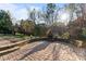 Outdoor living space with a beautiful stone patio and a cozy fire pit at 428 Vintage Hill Ln, Huntersville, NC 28078