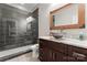 Modern bathroom with a glass walk-in shower, stylish sink, and a granite countertop at 428 Vintage Hill Ln, Huntersville, NC 28078
