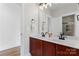 Bathroom with a double sink vanity, white countertops, and modern fixtures at 428 Vintage Hill Ln, Huntersville, NC 28078