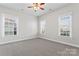 Bedroom with a ceiling fan and carpet with a view to the neighborhood outside at 428 Vintage Hill Ln, Huntersville, NC 28078