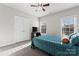 Comfortable bedroom with cozy bedding, plush carpeting, and natural light from the windows at 428 Vintage Hill Ln, Huntersville, NC 28078