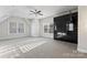 Spacious bedroom with plush carpeting, a ceiling fan, and a sleek built-in wardrobe at 428 Vintage Hill Ln, Huntersville, NC 28078