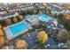 Aerial shot of community pools with a slide, playground, and ample parking at 428 Vintage Hill Ln, Huntersville, NC 28078