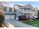Charming two-story home featuring a double porch, two-car garage, and spacious driveway at 428 Vintage Hill Ln, Huntersville, NC 28078
