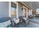 Inviting front porch with comfortable seating and stylish decor, perfect for relaxing outdoors at 428 Vintage Hill Ln, Huntersville, NC 28078