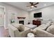 Cozy living room with a tiled fireplace, mounted flat screen, and comfortable seating arrangement at 428 Vintage Hill Ln, Huntersville, NC 28078