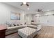 Spacious living room features hardwood floors, ceiling fans, and large sectional sofa with decorative pillows at 428 Vintage Hill Ln, Huntersville, NC 28078