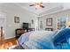 Spacious main bedroom featuring a tray ceiling, hardwood floors, and a comfortable bed at 428 Vintage Hill Ln, Huntersville, NC 28078