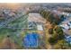 Aerial view of a community park with playground, basketball court, and sand volleyball court at 428 Vintage Hill Ln, Huntersville, NC 28078