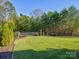 Spacious backyard with grassy area and privacy fence at 5702 Morris Hunt Dr, Fort Mill, SC 29708