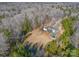 Aerial view of home with pool, long driveway, and mature trees providing privacy at 6610 Rolling Ridge Dr, Waxhaw, NC 28173