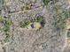Aerial view of wooded homesite with long driveway and mature trees providing privacy at 6610 Rolling Ridge Dr, Waxhaw, NC 28173