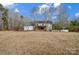 Backyard with a deck, expansive open space, and mature trees at 6610 Rolling Ridge Dr, Waxhaw, NC 28173
