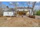 View of the back of the home and large backyard with deck at 6610 Rolling Ridge Dr, Waxhaw, NC 28173