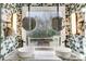 Stylish bathroom featuring double sinks, marble counters and nature view at 6610 Rolling Ridge Dr, Waxhaw, NC 28173