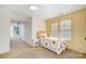 Bright bedroom with a sunflower bedspread, ample closet space, and natural light at 6610 Rolling Ridge Dr, Waxhaw, NC 28173