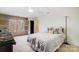 Bright bedroom featuring a bed with throw pillows, a large window, and hardwood floors at 6610 Rolling Ridge Dr, Waxhaw, NC 28173