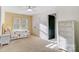 Bright bedroom with a sunflower bedspread, ample closet space, and natural light at 6610 Rolling Ridge Dr, Waxhaw, NC 28173