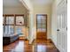 Bright entryway with hardwood floors, a wooden front door, and a sunlit window nook at 6610 Rolling Ridge Dr, Waxhaw, NC 28173