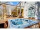 Inviting hot tub on the deck next to a covered outdoor living space at 6610 Rolling Ridge Dr, Waxhaw, NC 28173