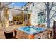 Inviting hot tub on the deck next to a covered outdoor living space at 6610 Rolling Ridge Dr, Waxhaw, NC 28173