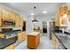 Bright kitchen with stainless steel appliances, a wooden island, and ample cabinet space at 6610 Rolling Ridge Dr, Waxhaw, NC 28173