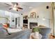 Comfortable living room showcasing hardwood floors, a fireplace, and stylish furniture at 6610 Rolling Ridge Dr, Waxhaw, NC 28173