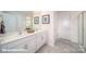 Modern bathroom featuring double sinks, white cabinets, and stylish decor at 124 Rustling Waters Dr, Mooresville, NC 28117