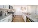 Kitchen featuring white cabinetry, stainless steel appliances, granite countertops, and hardwood floors at 124 Rustling Waters Dr, Mooresville, NC 28117