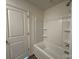 Bathroom with a tub and shower, and wood-look floors at 168 Salem Springs Ln, Statesville, NC 28625