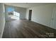 Well-lit bedroom with wood-look floors and ample space at 168 Salem Springs Ln, Statesville, NC 28625