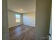 Bright bedroom with wood-look floors and a window at 168 Salem Springs Ln, Statesville, NC 28625