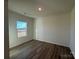 Bright bedroom with a large window and light brown laminate flooring at 168 Salem Springs Ln, Statesville, NC 28625