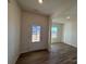 Light and airy entryway with wood-look flooring, leading to a living area at 168 Salem Springs Ln, Statesville, NC 28625