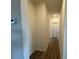 Clean hallway with light walls, wood-look floors, and access to other rooms at 168 Salem Springs Ln, Statesville, NC 28625