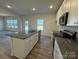 Modern kitchen with white cabinets, granite countertops, and stainless steel appliances at 168 Salem Springs Ln, Statesville, NC 28625