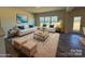 Spacious living room with comfy seating, large windows, and stylish decor at 168 Salem Springs Ln, Statesville, NC 28625