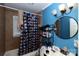 Bathroom featuring a shower-tub combo with tiled walls and stylish vanity with modern lighting at 1840 Findlay St, Gastonia, NC 28052