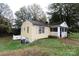 View of the home showing the backyard, yellow siding, and window placements at 1840 Findlay St, Gastonia, NC 28052