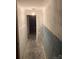 Unfinished hallway with bare walls leading to another room, prepped and ready for renovation at 1840 Findlay St, Gastonia, NC 28052