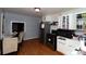 Cozy kitchen with stainless steel appliances, white cabinetry, and a dining area nearby at 1840 Findlay St, Gastonia, NC 28052