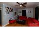 Inviting living room with hardwood floors, neutral walls, and bright natural lighting from the window at 1840 Findlay St, Gastonia, NC 28052
