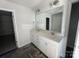 Bathroom featuring a double vanity with granite countertop, stylish lighting, and ample space at 200 Fostoria Pl # 78A, Albemarle, NC 28001